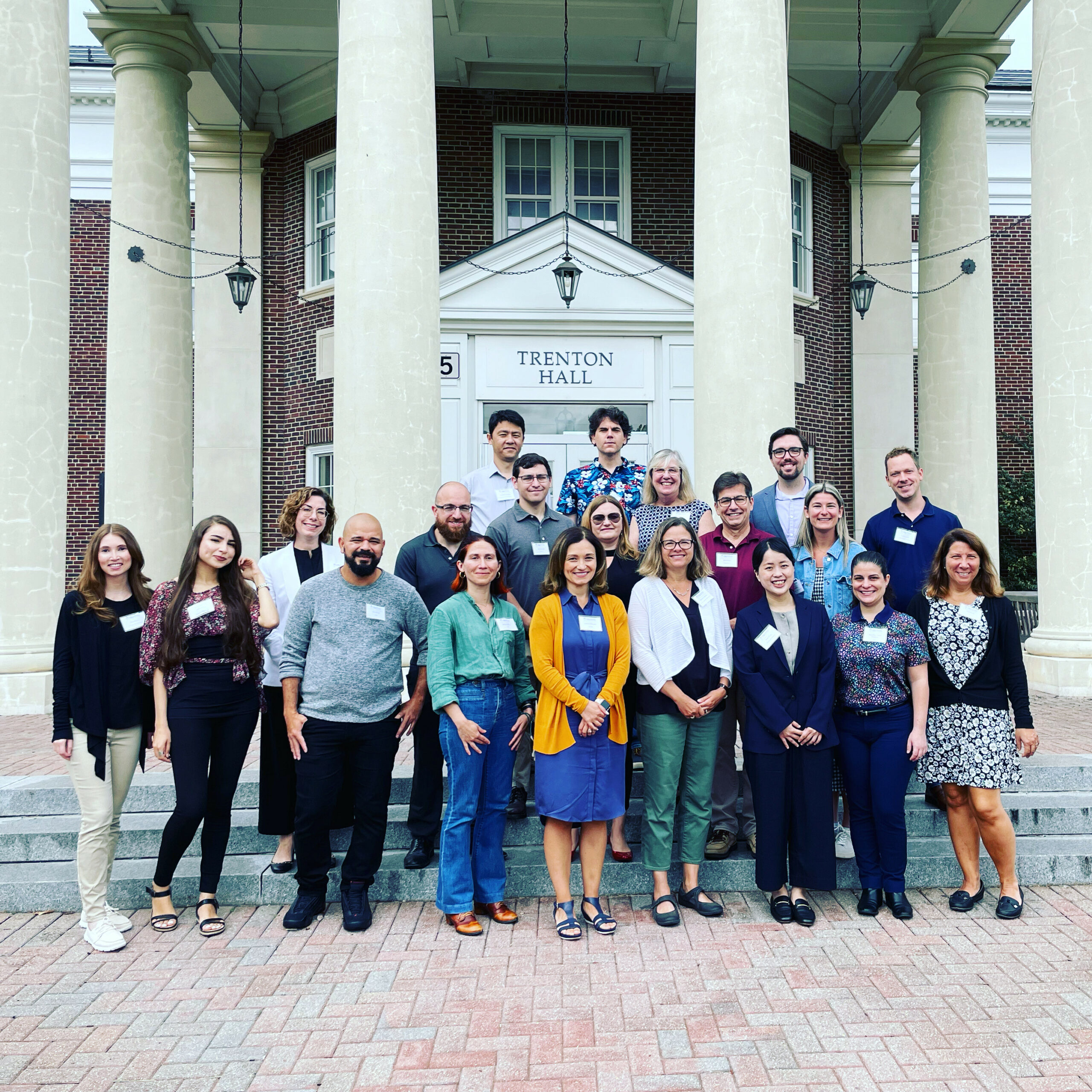 New Faculty standing in front of Trenton Hall